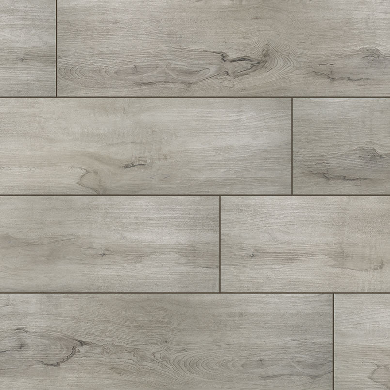 MSI XL Cyrus Dunite Oak Luxury Vinyl Planks (22.44 SQFT) feature a light gray natural grain and subtle knots, horizontal arrangement, waterproof SPC core, CrystaLux™ wear layer, and a smooth surface with a slight glossy finish.